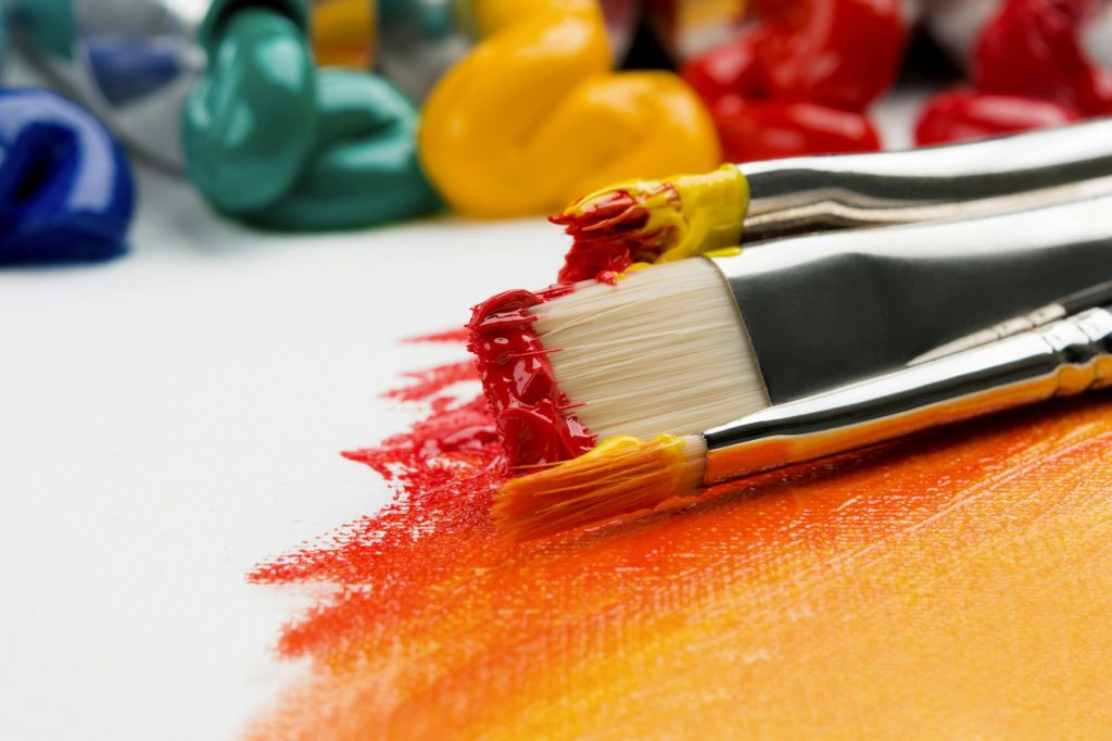 An artist working with paint